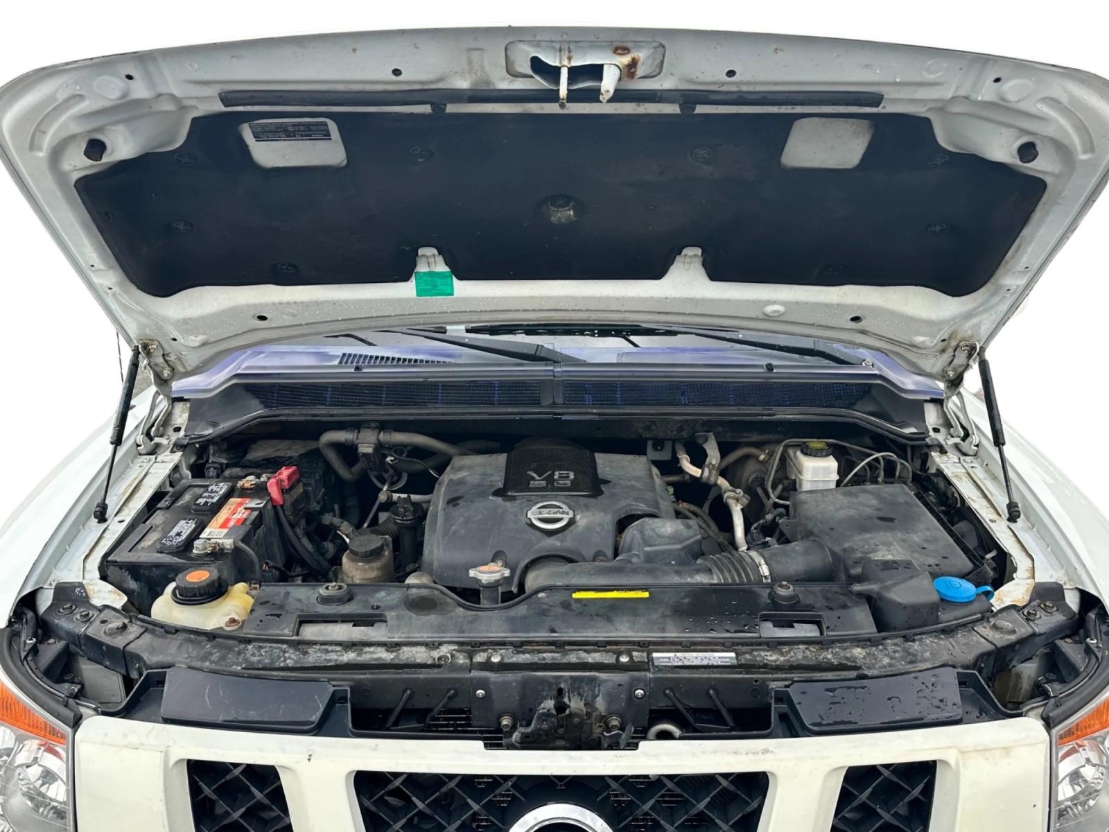 2013 White /Black Nissan Titan Pro-4X (1N6AA0EC0DN) with an 5.6L DOHC 32V V8 engine, Automatic transmission, located at 547 E. Main St., Orwell, OH, 44076, (440) 437-5893, 41.535435, -80.847855 - This 2013 Nissan Titan Pro-4X Crew Cab is a capable and well-equipped full-size pickup truck. It features a powerful 5.6L Endurance V8 engine paired with a 5-speed automatic transmission, a locking rear differential for improved traction, and a maximum towing capacity of 9,300 pounds. The truck is l - Photo #10